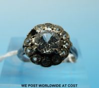 A silver and 9ct gold ring set with white sapphires in a cluster (size L)