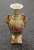 A Royal Worcester blush ivory gilded urn decorated with flowers, height 20.5 cm. CONDITION REPORT: