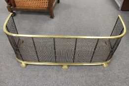 A Victorian brass low fire guard fender, width 105 cm.