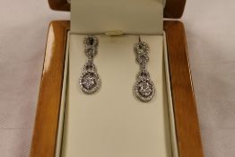 A pair of 18ct  white gold diamond drop earrings. (2) CONDITION REPORT: Good condition.