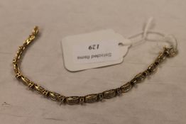 A 14ct gold diamond bracelet. CONDITION REPORT: Good condition.