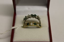 Two 18ct gold diamond and emerald rings.