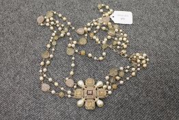 A Chanel three stranded necklace set with faux gemstones. CONDITION REPORT: Good condition.