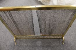 A Victorian brass curtain fire guard, width 97 cm.