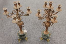 A pair of ornate spelter and marble four-way candelabra, height 60 cm. (2) CONDITION REPORT: Good