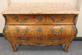 A French ormolu mounted three drawer bombe commode, with rouge marble top, width 124 cm. CONDITION