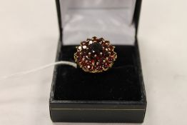 A 9ct gold garnet cluster ring. CONDITION REPORT: Good condition.