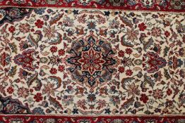 A Kashmir fringed carpet runner on cream