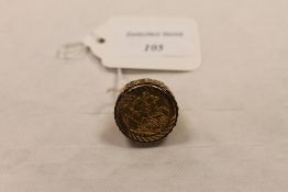 A 9ct gold gentleman's ring mounted with a 1903 gold sovereign. CONDITION REPORT: Good condition.