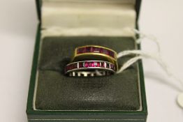 An 18ct gold five stone ruby ring, toget
