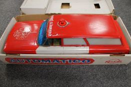 A Pico tin plated battery operated fire service vehicle, 'bump n' go' action, boxed. CONDITION
