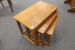 A nest of oak tables by Robert 'Mouseman' Thompson of Kilburn, width 61cm.