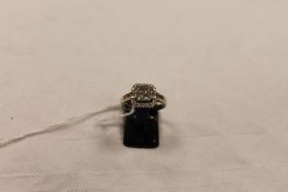 An 18ct white gold diamnd cluster ring. CONDITION REPORT: Good condition, with insurance valuation