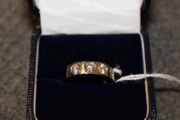 A platinum four stone diamond ring.