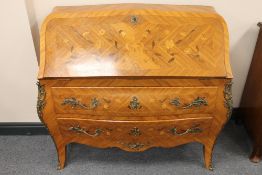 A French ormolu mounted inlaid walnut bombe bureaux, width 107 cm. CONDITION REPORT: Good