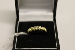An 18ct gold seven stone diamond ring, a