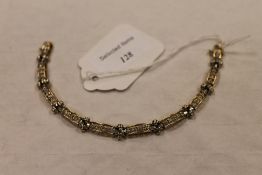 A 14ct gold diamond bracelet. CONDITION REPORT: Good condition.