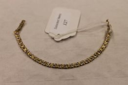 A 10ct gold diamond bracelet. CONDITION REPORT: Good condition.
