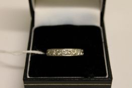 A platinum diamond eternity ring, approx
