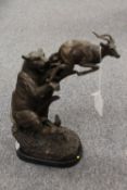 A bronze study of a leopard catching a g