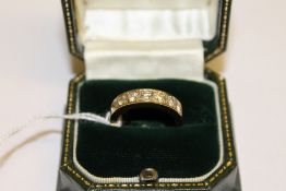An 18ct gold diamond seven stone eternit