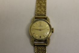 A 9ct gold Omega lady's wrist watch.