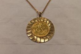 A 1963 gold sovereign, mounted in 9ct gold and suspended upon a flat trace chain. CONDITION