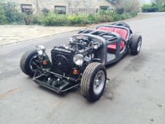 A work-in-progress kit car, with a 3.