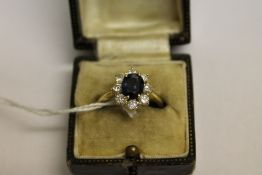 An 18ct gold sapphire and diamond cluste
