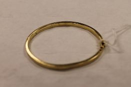 A 9ct gold bangle, 9.1g. CONDITION REPORT: Good condition, with import marks.