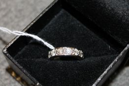 An 18ct white gold seven stone diamond ring.