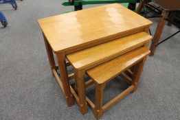A nest of oak tables by Robert 'Mouseman' Thompson of Kilburn, width 61 cm.