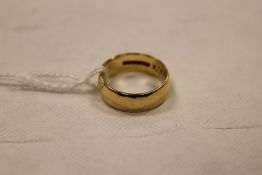An 18ct gold wedding band, 5.7g. CONDITION REPORT: Good condition, lightly inscribed internal.