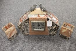 A three piece Art Deco marble clock set surmounted by birds, width 33 cm. (3) CONDITION REPORT: Good
