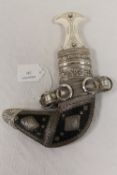 A fine khanjar dagger mounted in white metal. CONDITION REPORT: A twentieth century example in