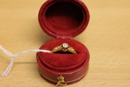 An 18ct gold diamond solitaire ring.
