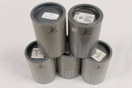 A collection of five Swarovski crystal o