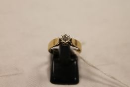 A 9ct gold diamond solitaire ring. CONDITION REPORT: Good condition with illusion setting.
