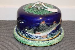 A nineteenth century majolica dish and cover, with fish decoration, diameter 26.5 cm. CONDITION