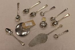 A silver caddy spoon, together with a silver preserve jar top, eight items of silver cutlery and a