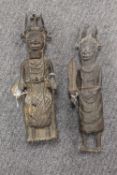 Two African bronze figures wearing tribal dress, height 38 cm. (2) CONDITION REPORT: Good