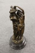 A bronze study depicting a Lady by a pillar on black marble socle, height 35 cm.  CONDITION