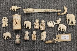 Four early twentieth century Chinese carved ivory netsukes, together with a number of other carvings