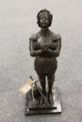 A bronze study depicting a knight praying on black marble plinth 39 cm.  CONDITION REPORT: Good