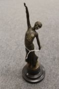 After D.H. Chiparus - A bronze study depicting an art deco style Lady with arm raised on black