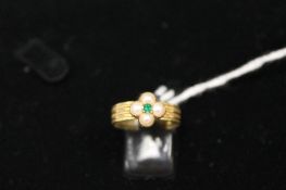 An early Georgian pearl and emerald ring. CONDITION REPORT: Good time aged conditions.