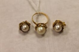 A pair of continental yellow metal pearl earrings, together with the matching faux pearl dress ring.