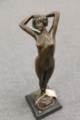 After Phillipps -  bronze study of a naked lady on tip toes on black marble base, height 40 cm.