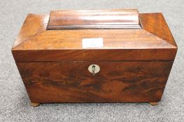A Victorian mahogany tea caddy, width 30 cm. CONDITION REPORT: On later wooden feet, with a glass