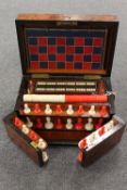 An early twentieth century burr yew wood games compendium, with compartmentalised interior, width 33